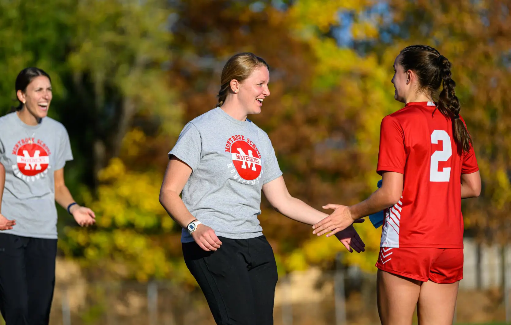 Two coaches with student