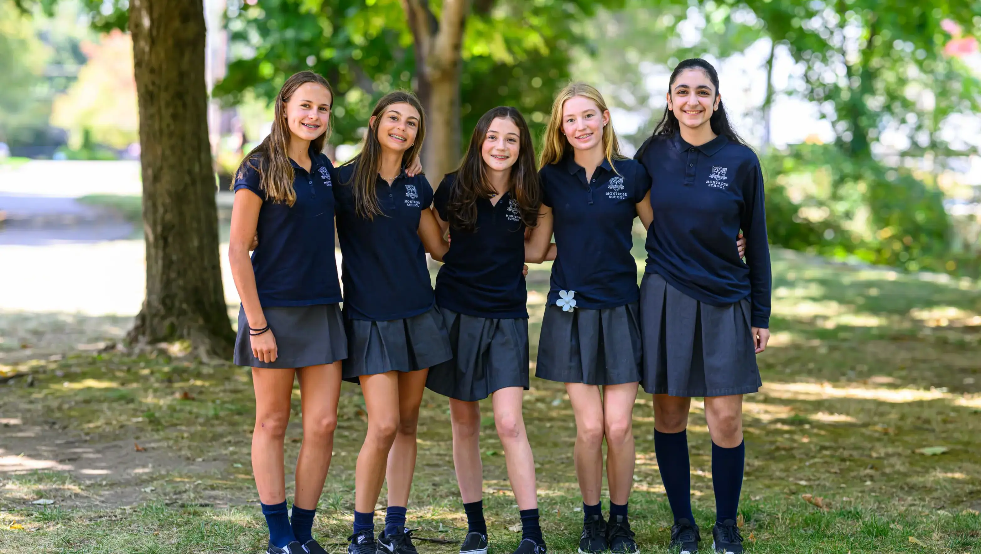 Image of four senior students smiling