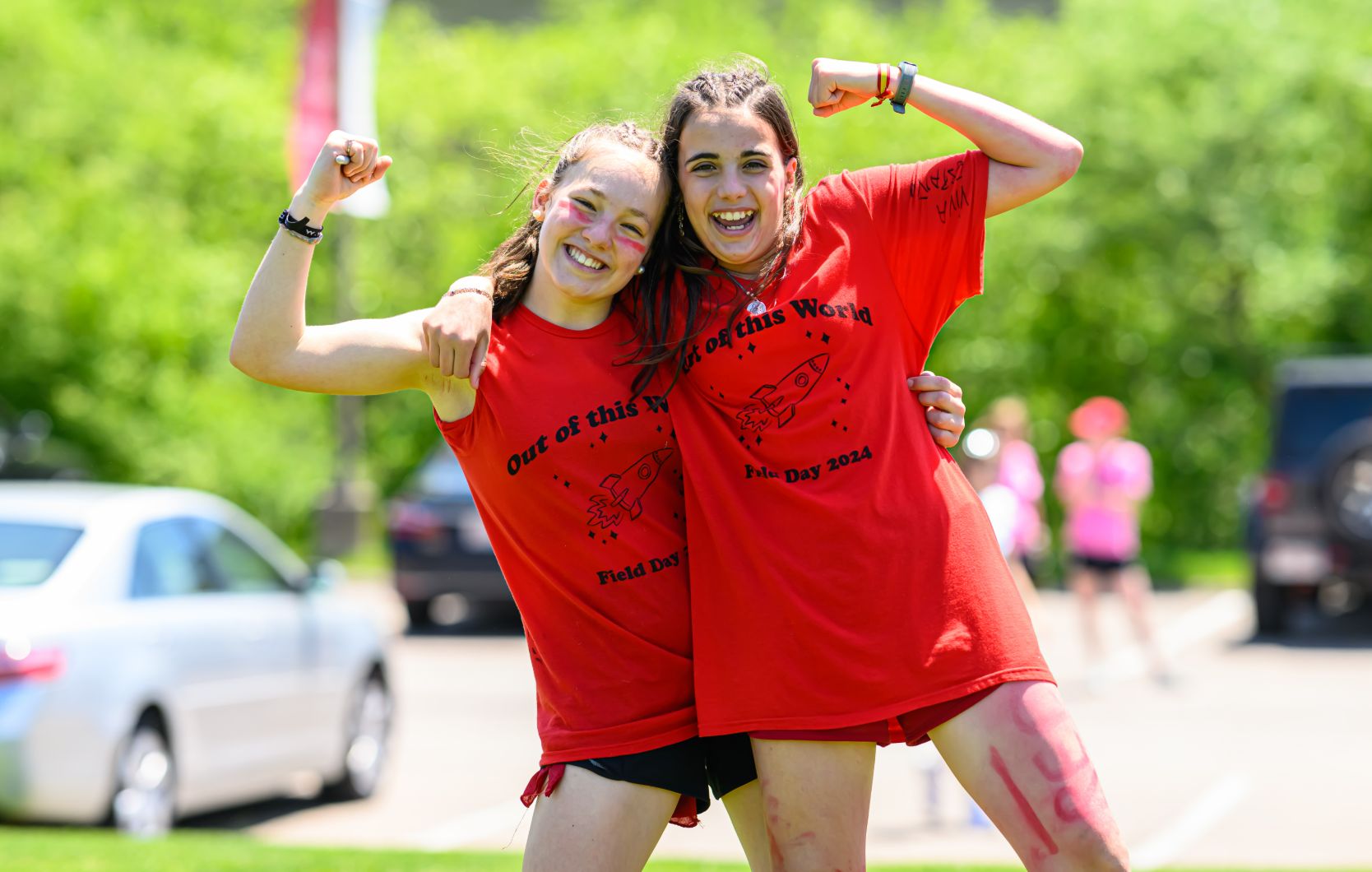Two students on Red and White Team day
